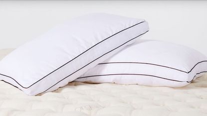 Two pillows propped on a mattress