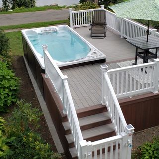 garden area with stairs fence and hot tub deck