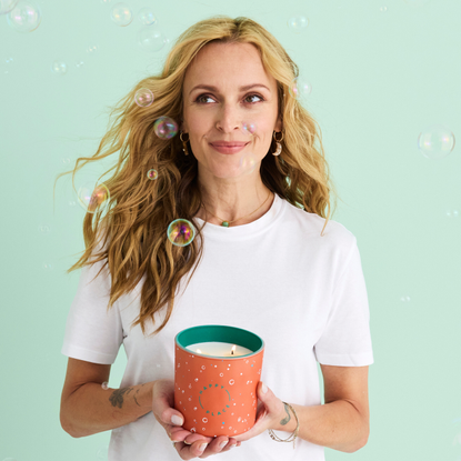 Fearne Cotton holding a happy place candle