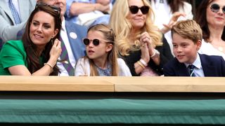 Catherine, Princess of Wales, Princess Charlotte of Wales and Prince George of Wales are seen in the Royal Box during the Men's Singles Final