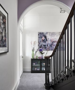 Purple and grey hallway ideas by Carpetright with arched wall paint idea and wall art