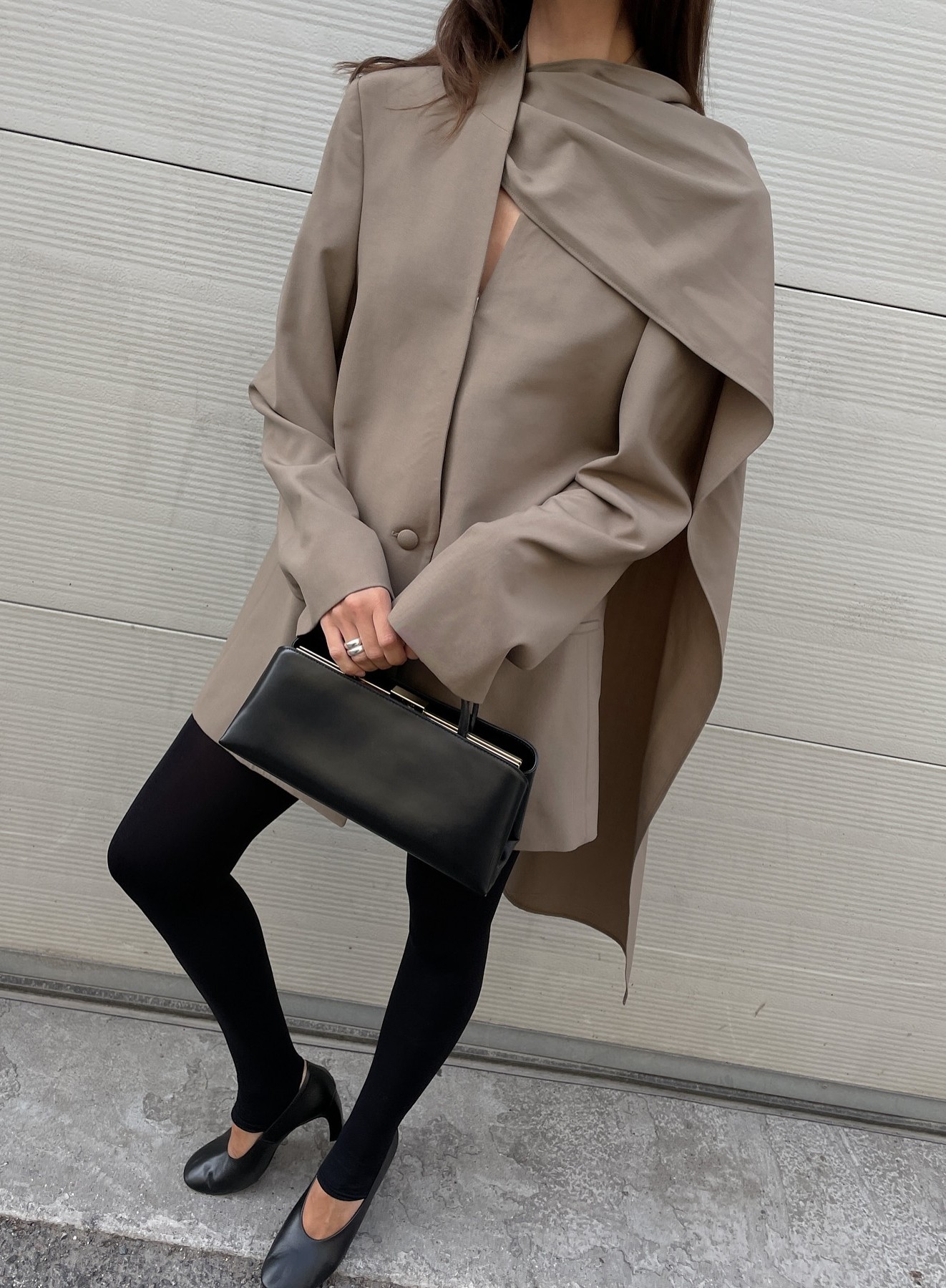 An image of @johannapiispa wearing a collarless blazer, one of the biggest trends making a comeback for winter 2025, with stirrup leggings and round-toe pumps.