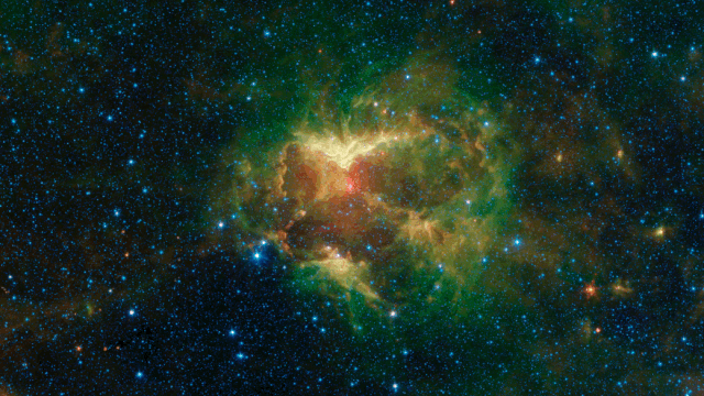 Outflows of radiation and particles from a massive O-type star carved deep gouges in this nebula, making the cloud of gas and dust look like a spooky jack-o'-lantern. 