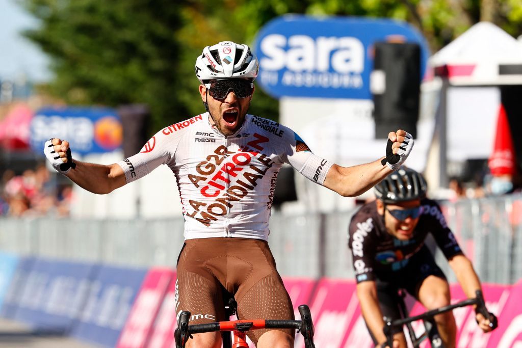 Team AG2R rider Italys Andrea Vendrame celebrates as he crosses the finish line to win the twelfth stage of the Giro dItalia 2021 cycling race 212 km between Siena and Bagno di Romagna on May 20 2021 Photo by Luca Bettini AFP Photo by LUCA BETTINIAFP via Getty Images
