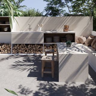 Grey concrete patio area with outdoor cooking unit