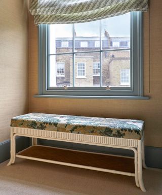 a hallway decorated with a reupholstered bench this antique textiles