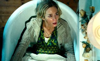 Emily Blunt lying in a bathtub in a scene from A Quiet Place