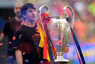 Lionel Messi with the Champions League trophy at Barcelona's victory celebrations at the Camp Nou, following the 2011 final win over Manchester United