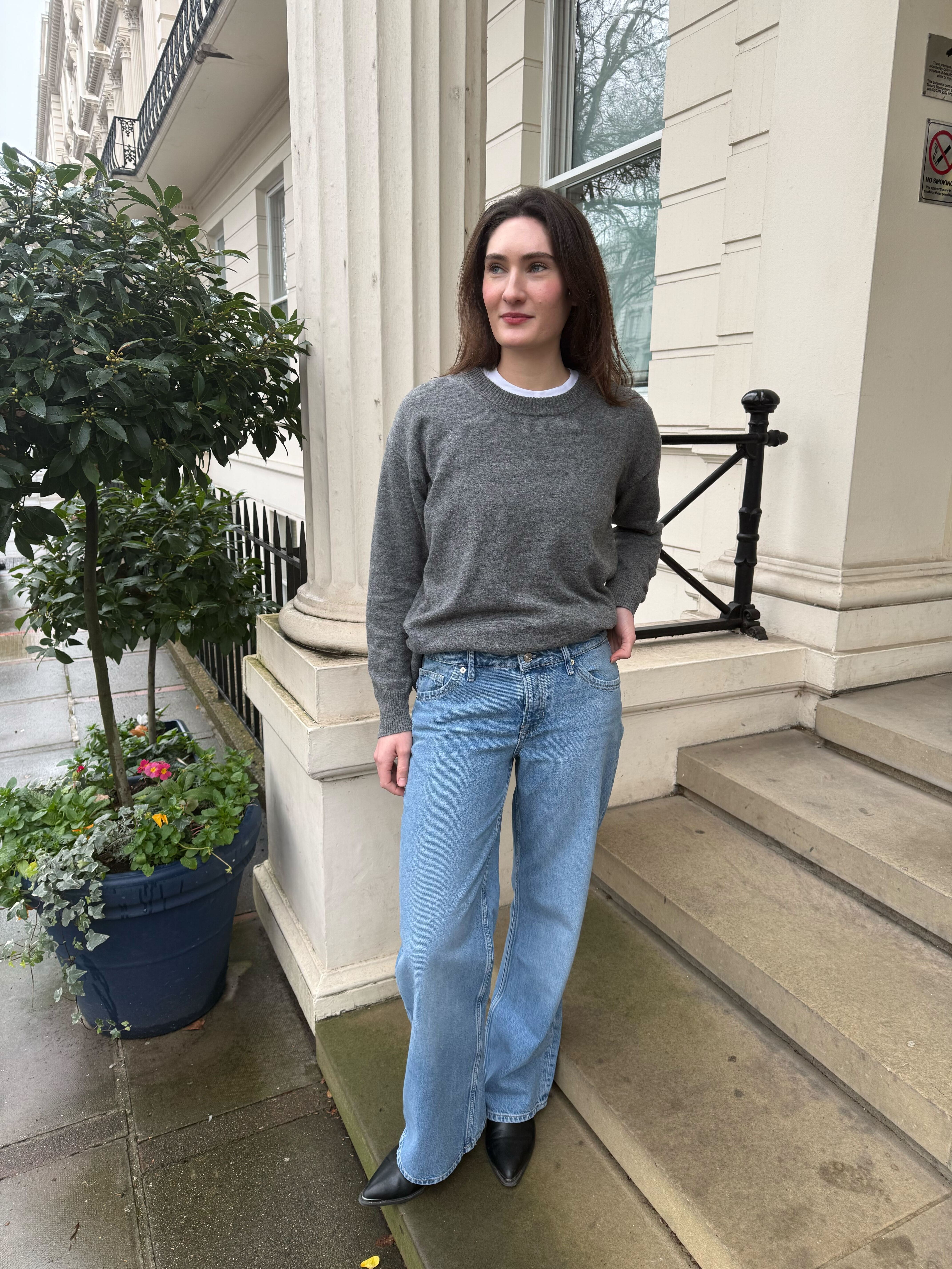 An image of Who What Wear UK news writer, Natalie Munro, wearing one of the best low-rise jeans from Free People.