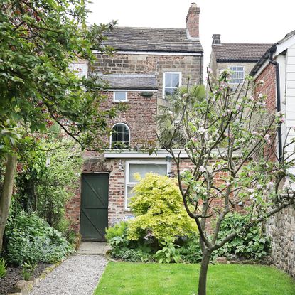 Exterior view of a Georgian townhouse with a walled garden