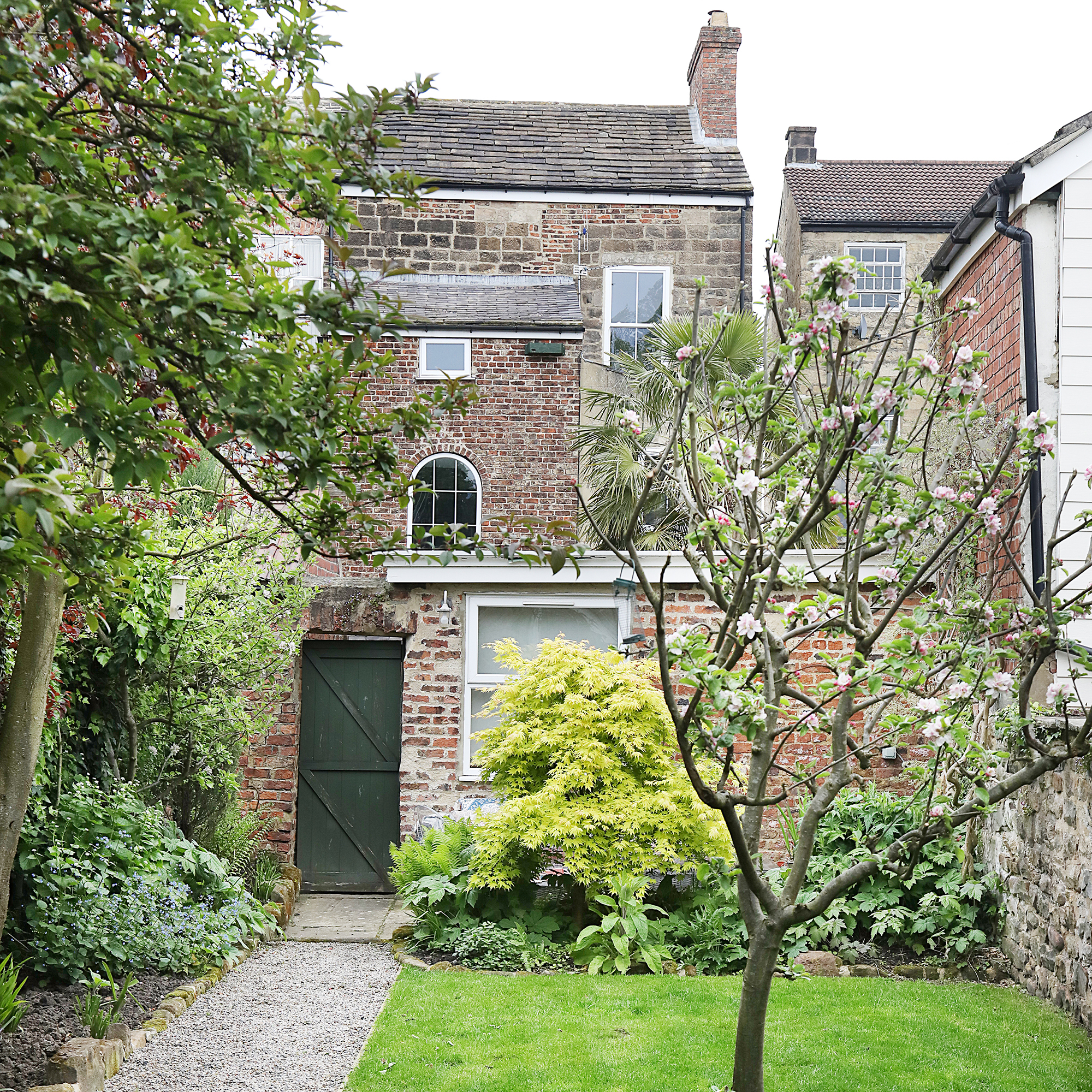 Exterior view of a Georgian townhouse with a walled garden