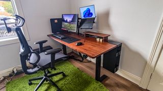 An ErgoTune Supreme V3 chair sitting in front of a fully-assembled EverDesk Max