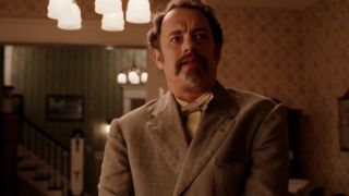 Tom Hanks with a mustache and goatee in The Ladykillers