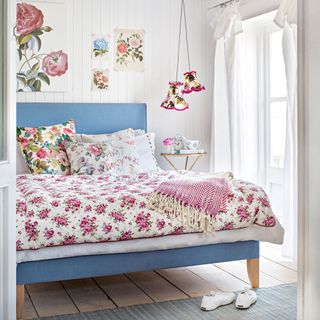 bedroom with floral bed and pillows