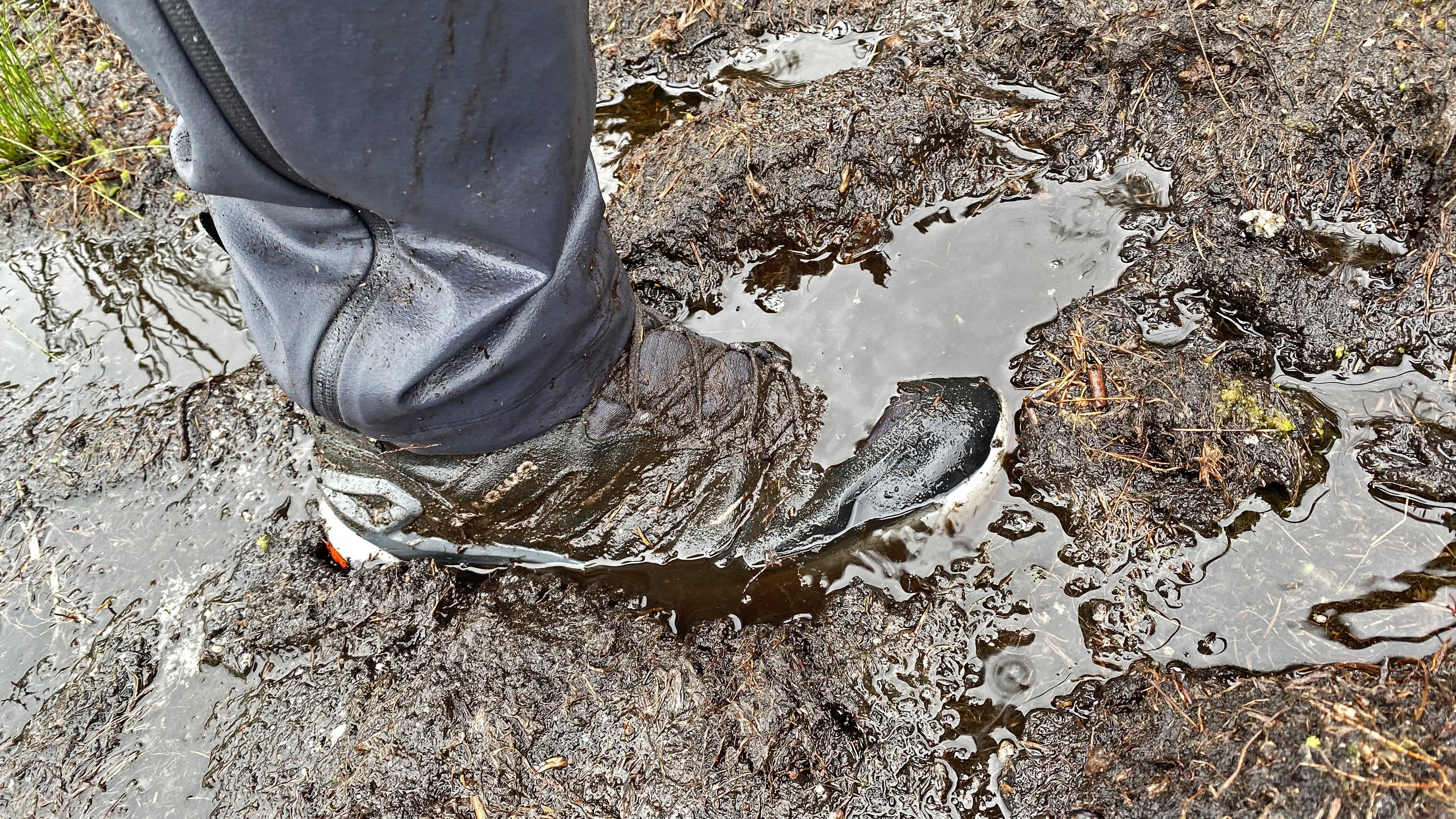 Hiker tackling bogs in the Lowa Innovo Mid GTX hiking boots