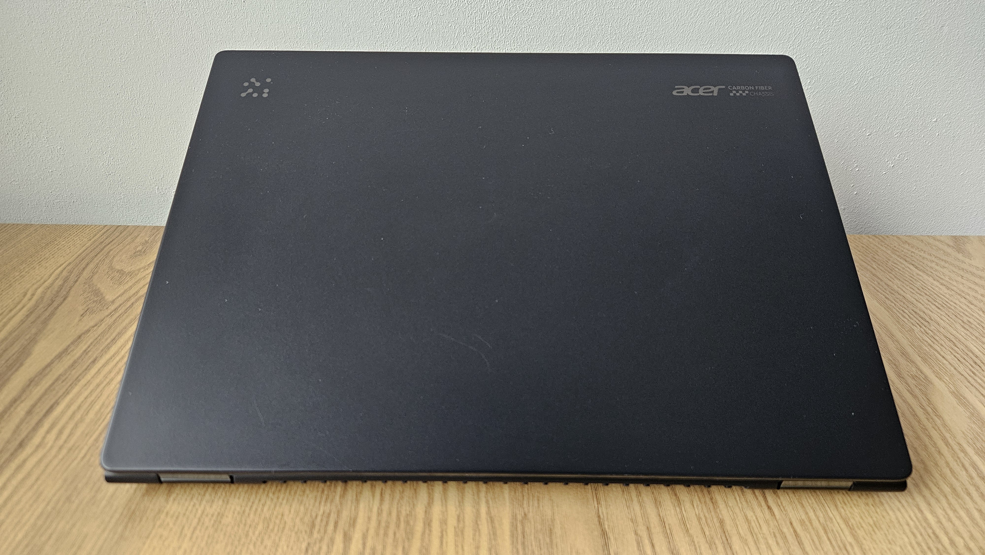 The Acer TravelMate P6 14 AI on a desk