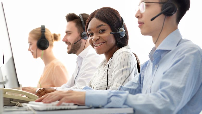 Person in a call center using a voip phone.