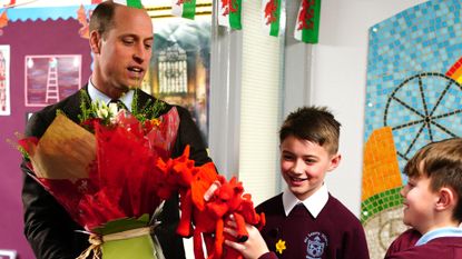 Prince William holding flowers on St. David's Day