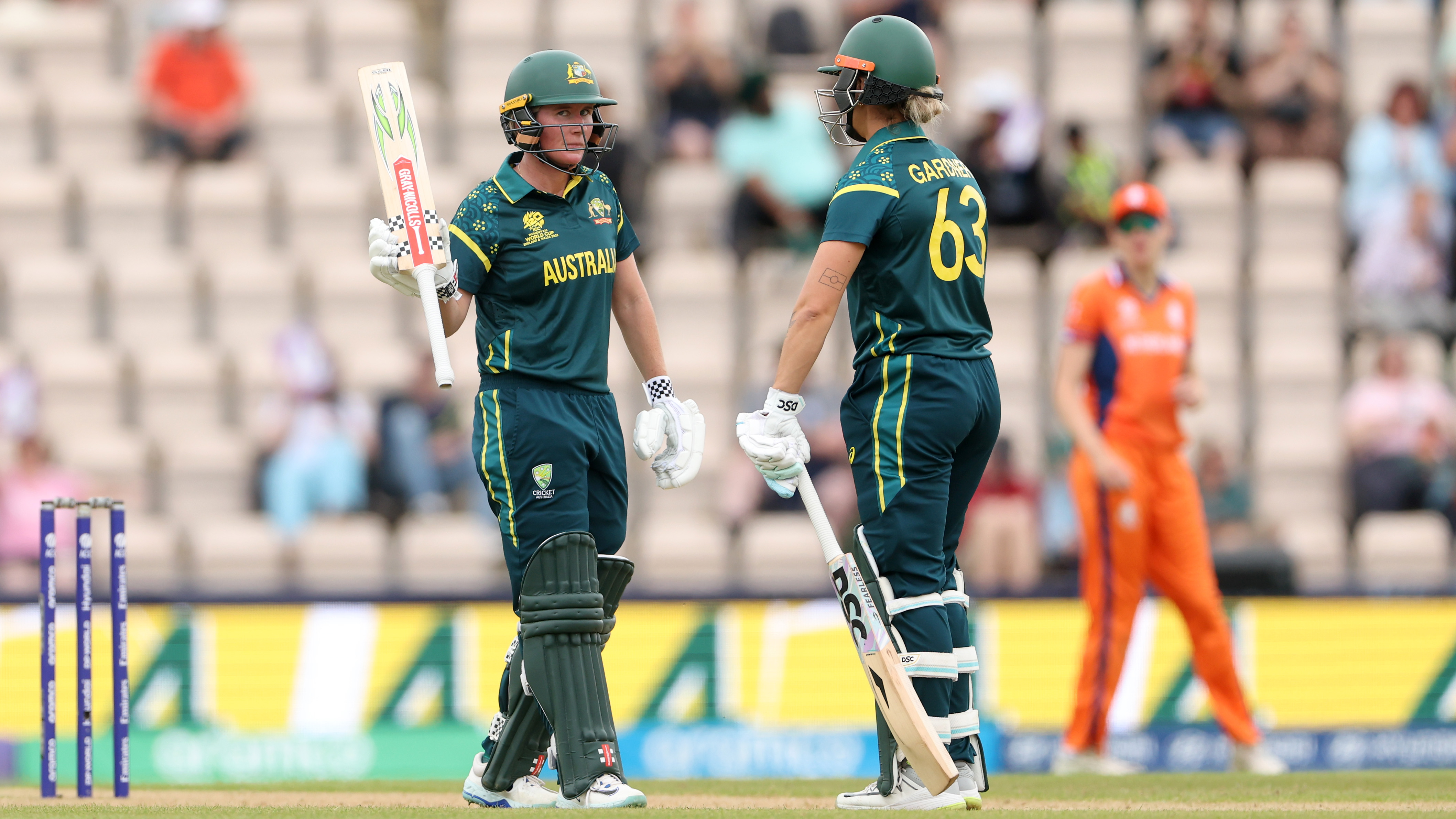 Beth Mooney of Australia celebrates her fifty runs with her teammate Ashleigh Gardner during the ICC Women's T20 World Cup Group A match between Australia and Netherlands
