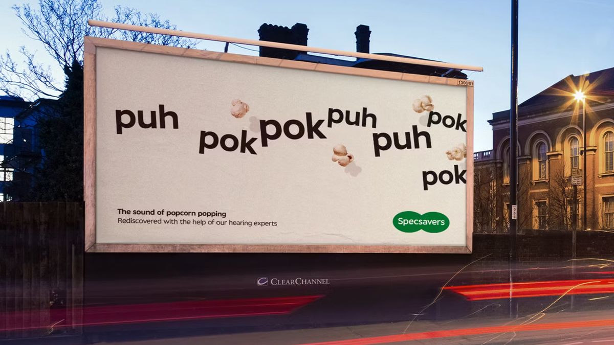 Specsavers billboard ad featuring text that reads &quot;the sound of popcorn popping&quot; 