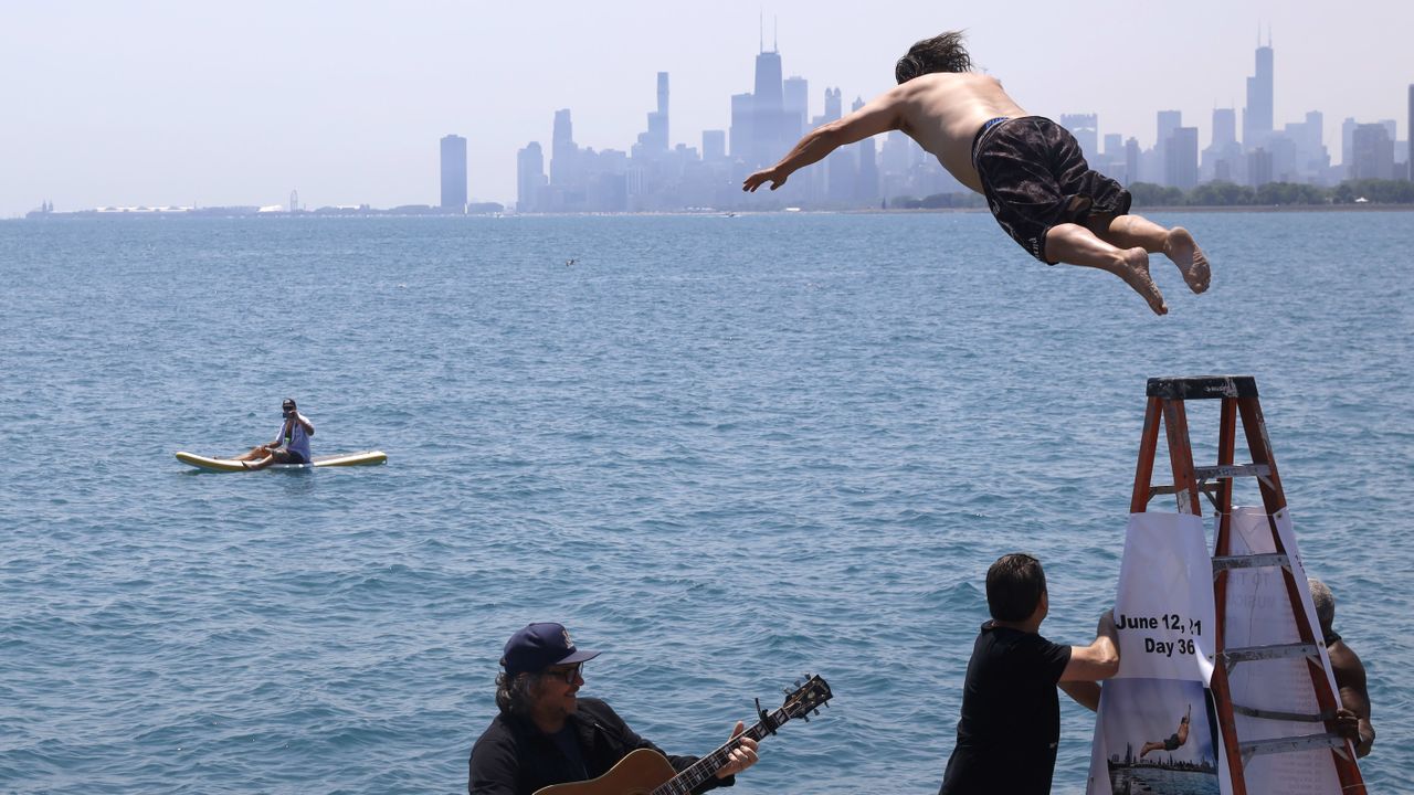 Dan O&amp;#039;Conor jumps into Lake Michigan.