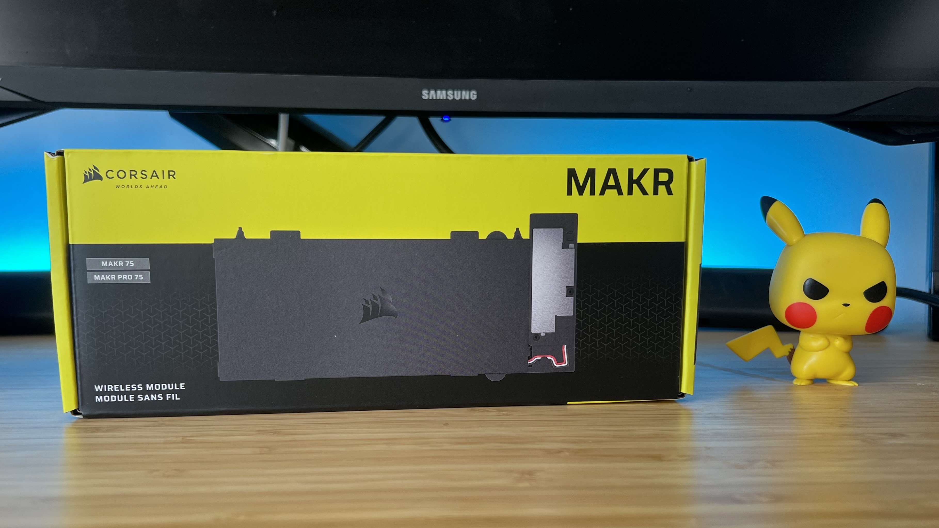 Corsair MAKR wireless module packaging on a wooden desk