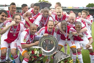 Ajax players celebrate in April 2014 after winning the Eredivisie for the fourth season in a row.