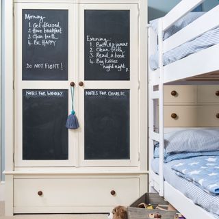 child's bedroom with wardrobe chalkboard memo boards on doors