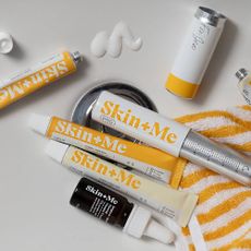 A variety of Skin + Me products on a white background.