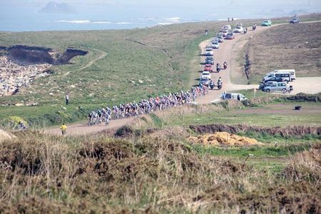 The peloton swoops down the coastline of Northern France.
