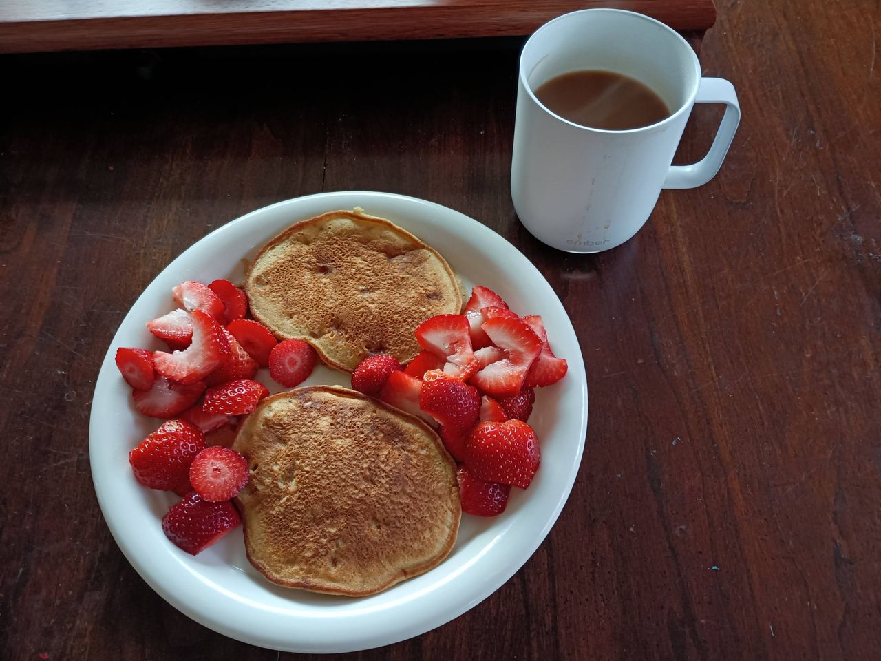Pancakes and strawberries on a plate