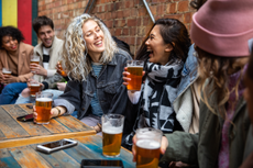 friends drinking at a pub - are pubs closing again?