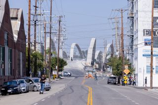 Sixth Street Viaduct in Los Angeles peeking through buildings