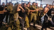 Israeli soldiers and police clash with right wing protesters, after they broke into the Bayt Lid army base