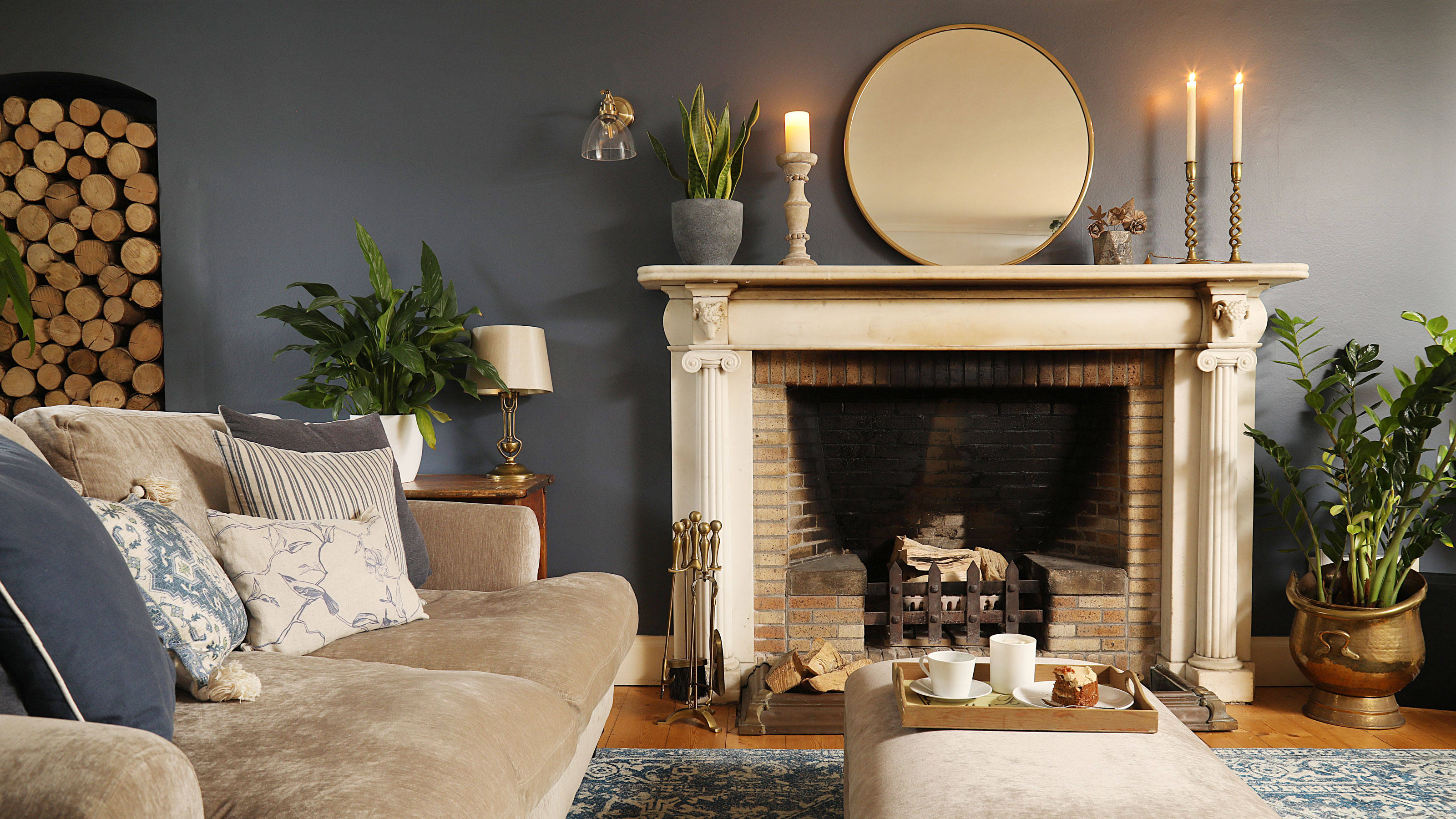 Blue living room with beige sofa and blue rug