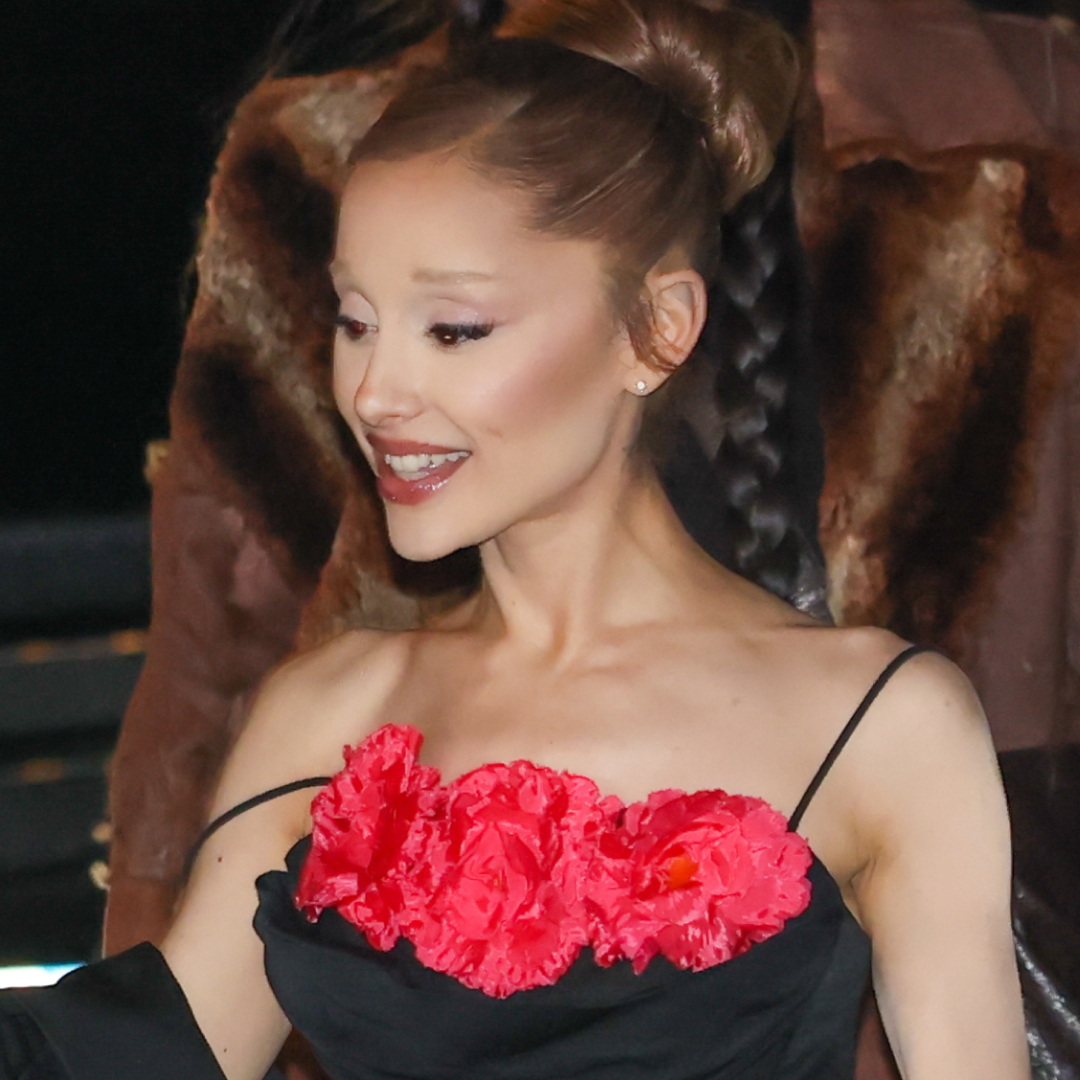 Ariana Grande attended the Wicked Paris premiere in a black gown with satin "Glinda" pink accents