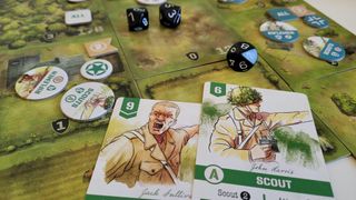 Close up of Undaunted: Normandy pieces, cards, and dice