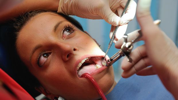 A dentist treating a patient