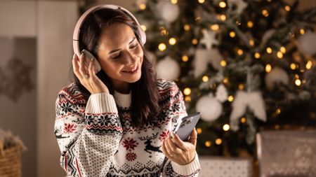 Woman listening to music at Christmas