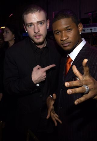 Justin Timberlake and Usher during 2003 Clive Davis Pre-GRAMMY Party - Inside at The Regent, Wall Street in New York, New York, United States.