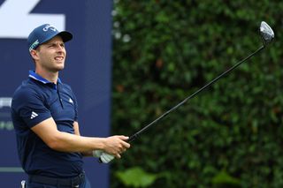 Matthew Jordan hits a tee shot with a driver and watches its flight