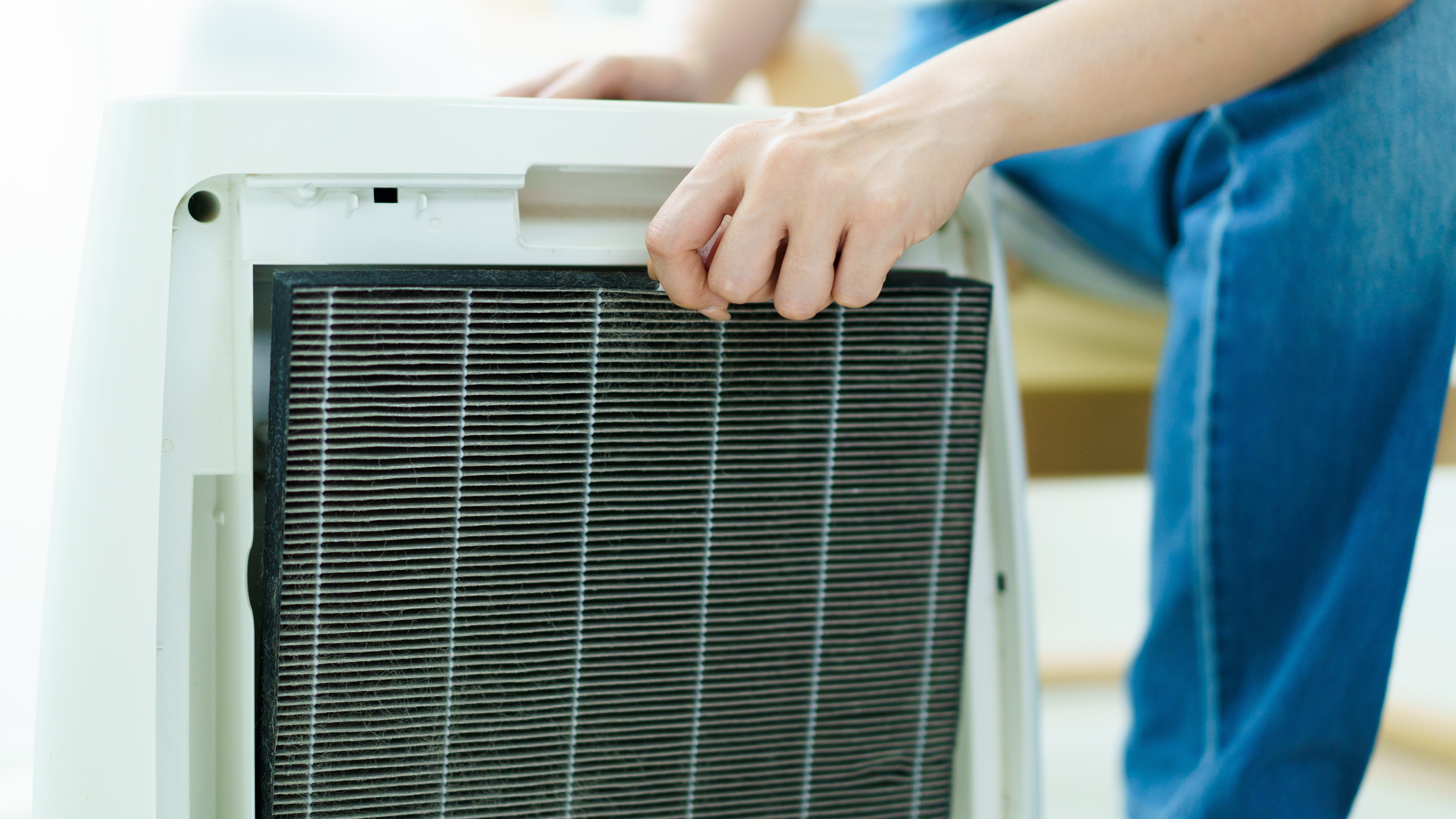 Man replacing an air purifier filter