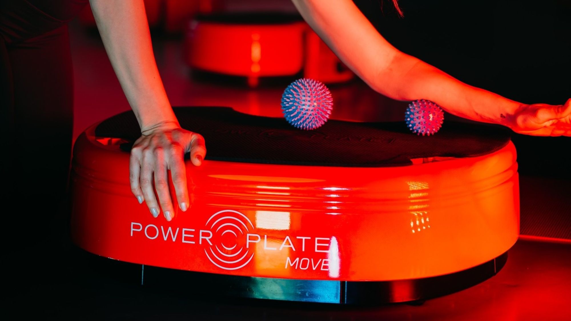 woman using Power Plate vibration plate