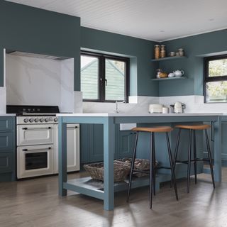 Blue kitchen with white countertops