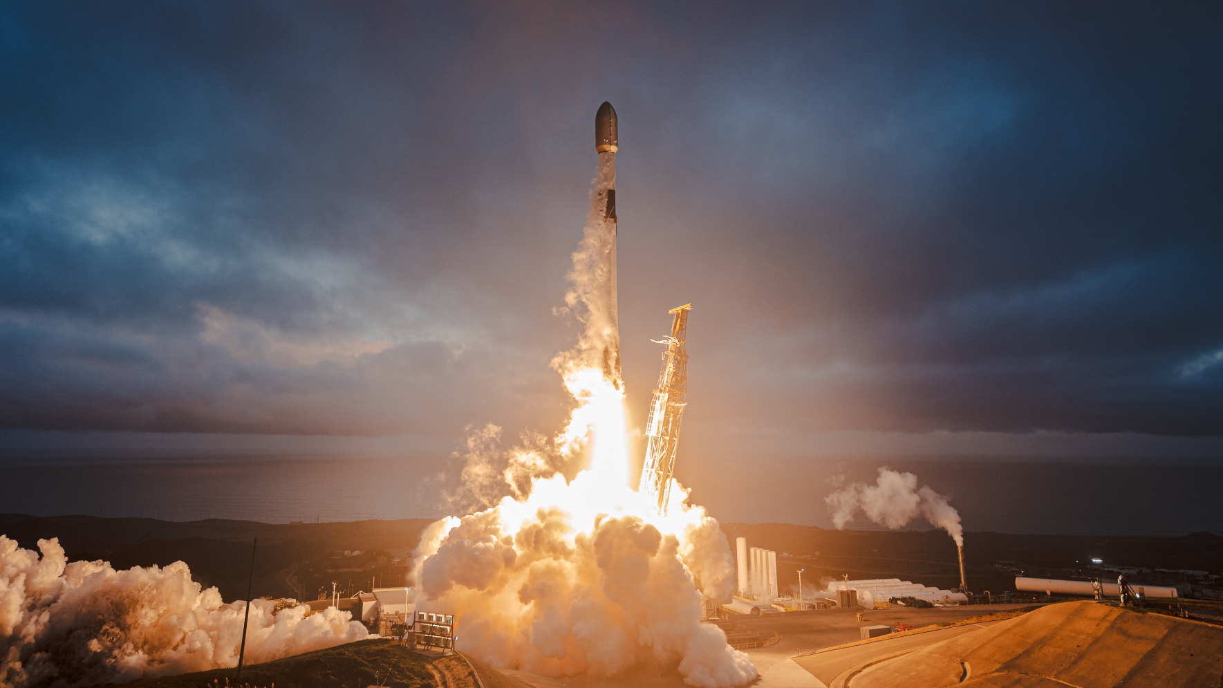A SpaceX Falcon 9 rocket launches 28 Starlink satellites from Vandenberg Space Force Base in California on Oct. 3, 2025.