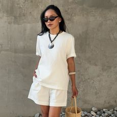 Dawn Tan wears an all-white summer outfit.