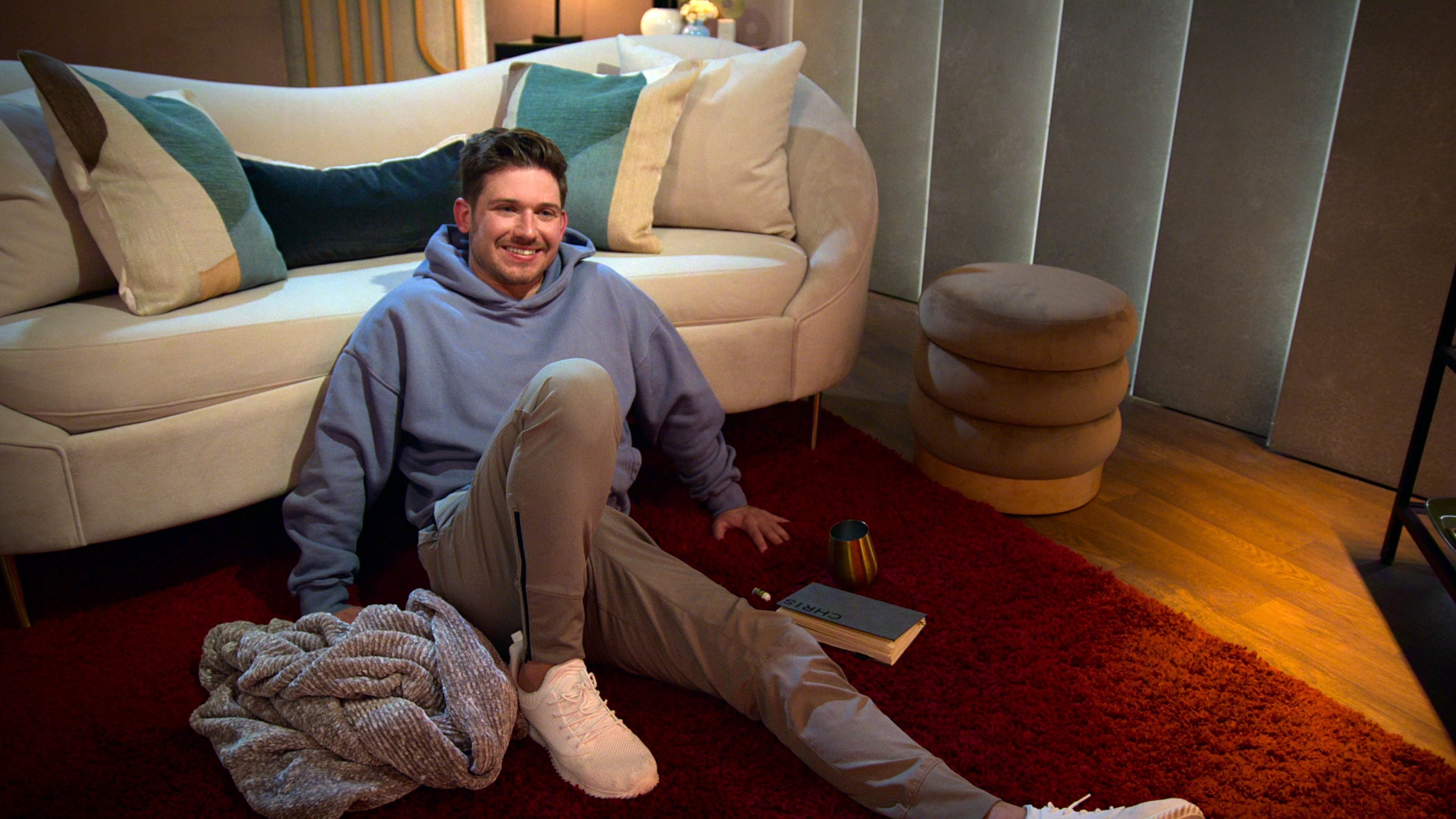 Chris Fusco sits on the floor of a pod in episode 1003 of 'Love Is Blind.'