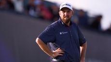 Shane Lowry with his hands on his hips at The Open