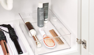 plastic box in a shelf with hair styling products