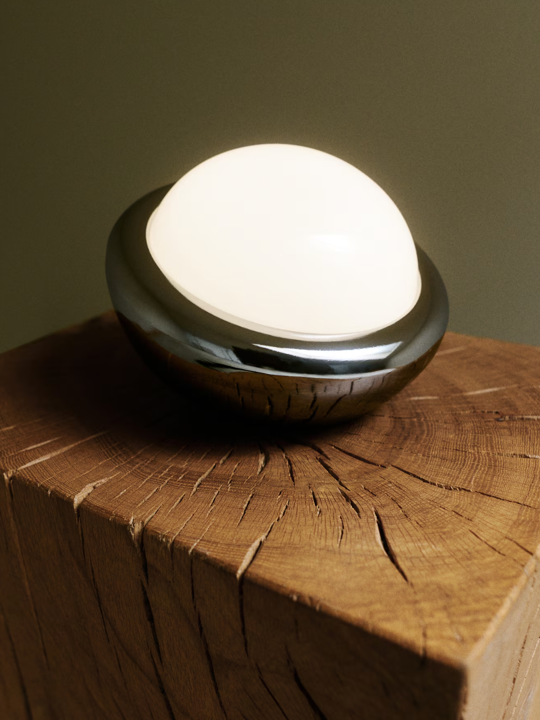 A portable, rechargeable silver table lamp from H&amp;amp;M
